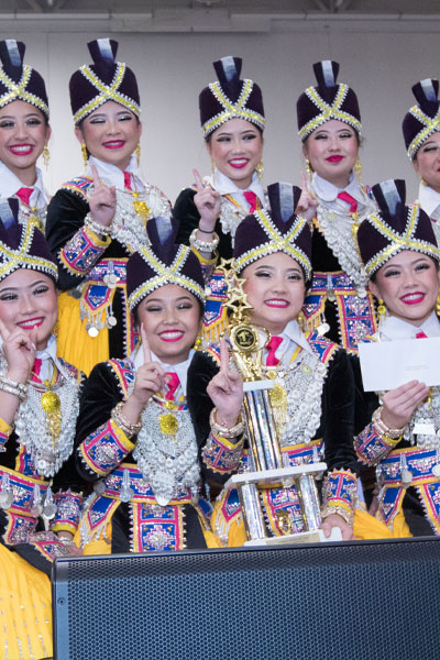 A group of Hmong traditional dancers posing